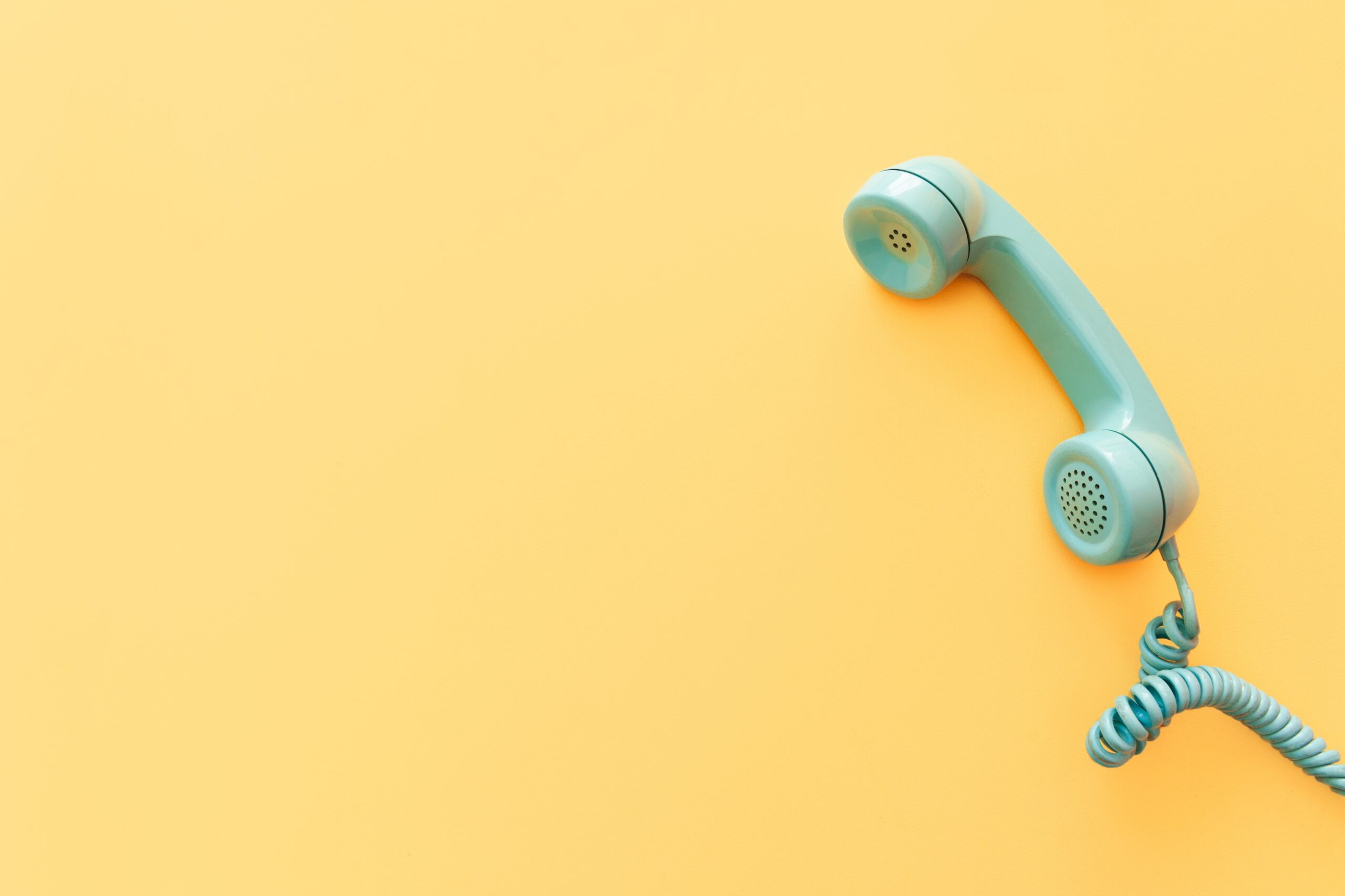 teal-phone-on-yellow